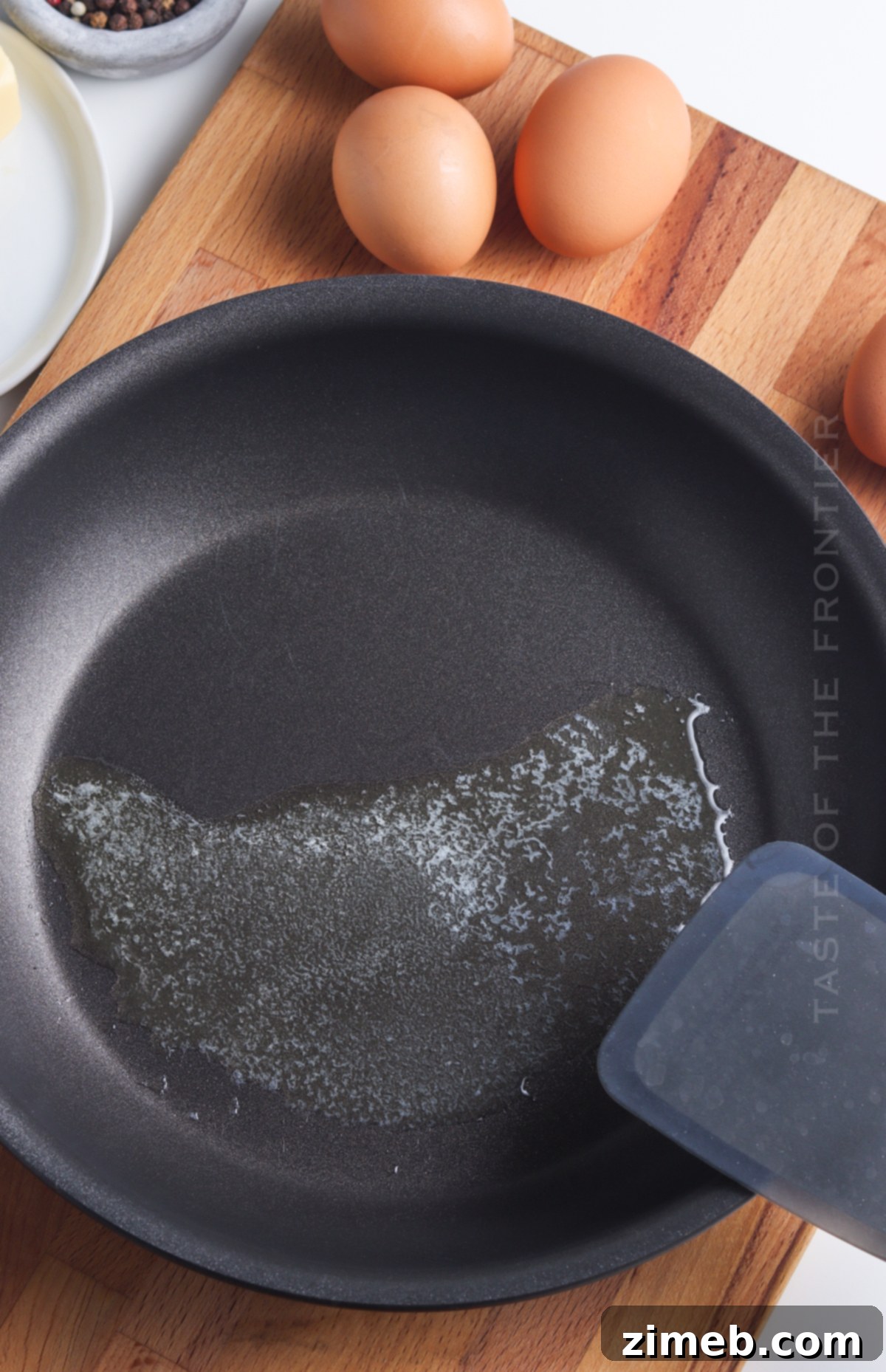 Sunrise Yolk 6 Melting butter in the skillet