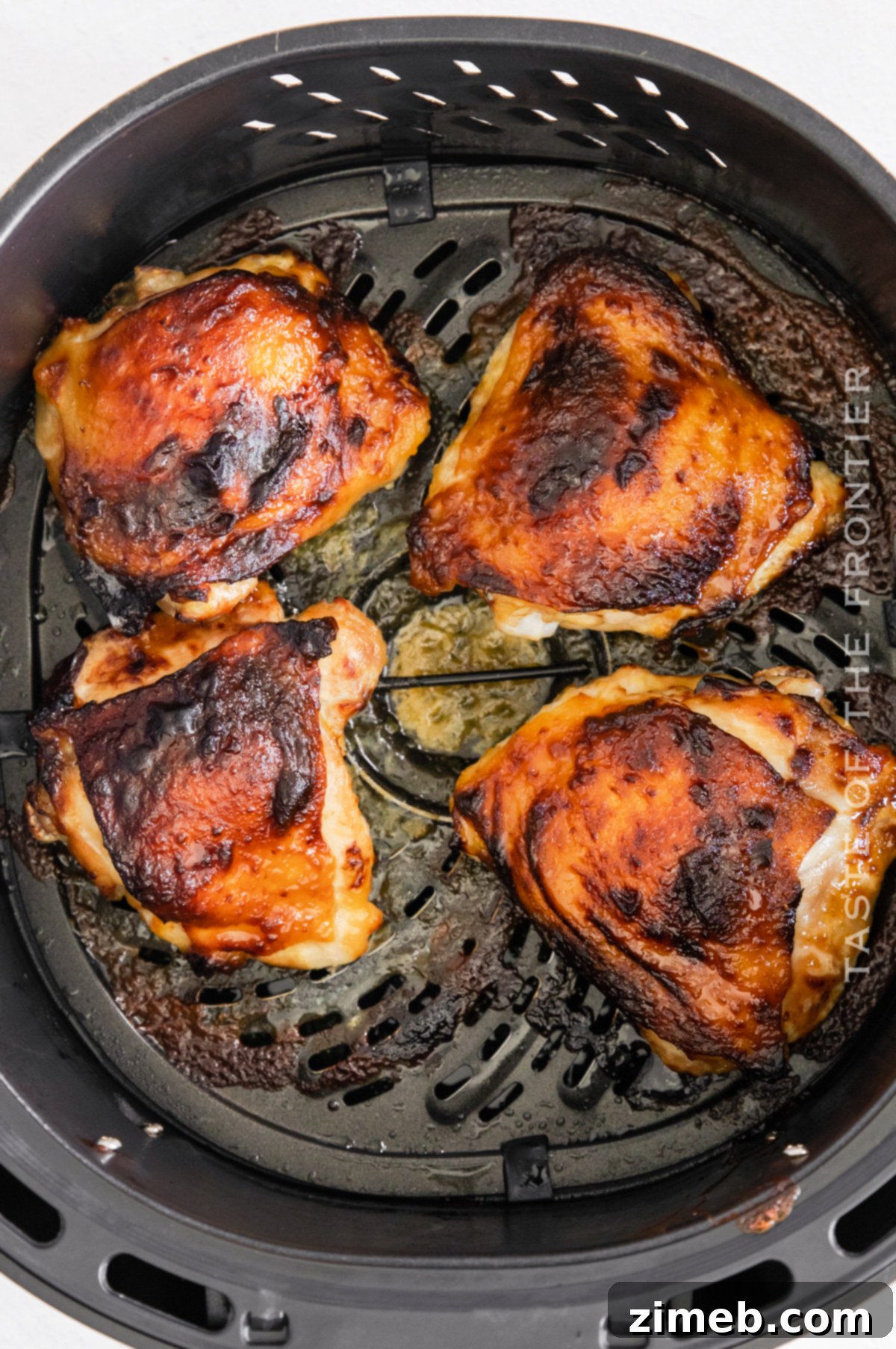 Sticky Honey Mustard Air Fryer Chicken Thighs 7 Air fried honey mustard chicken thighs, golden and ready to serve