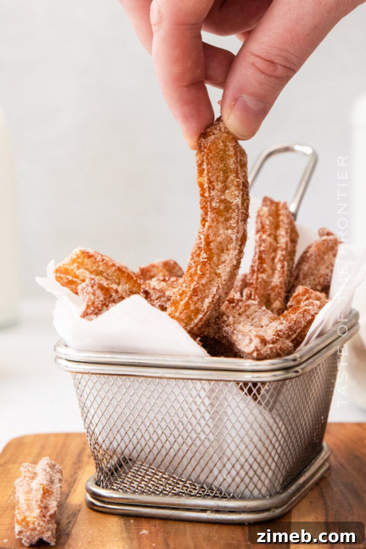 Homemade Churro Perfection 19 Close-up of a churro, a cinnamon sugar treat, showing its crispy texture.