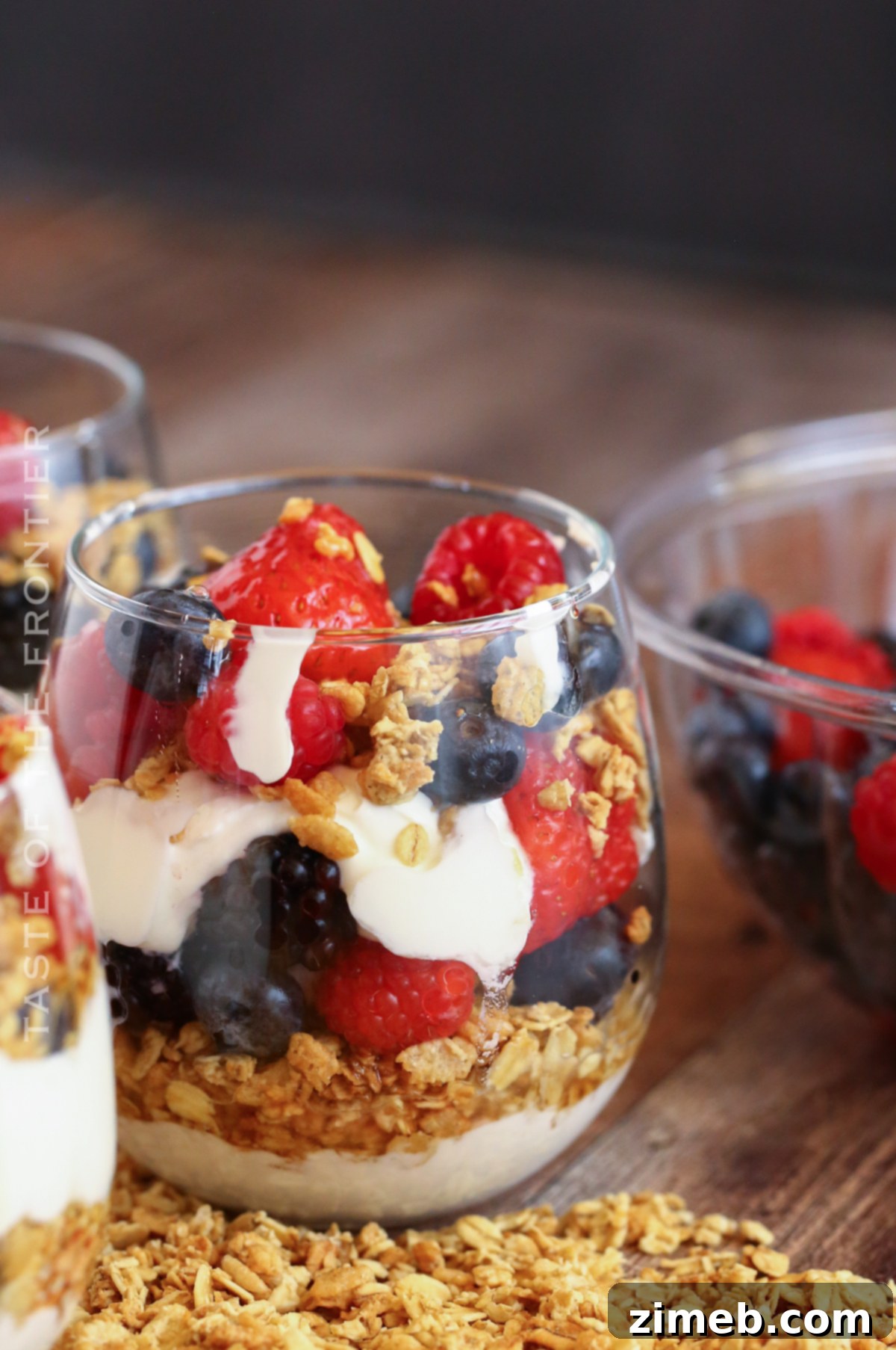 Premium Layered Dessert Glasses 11 A festive patriotic breakfast parfait, showcasing red, white, and blue berries.