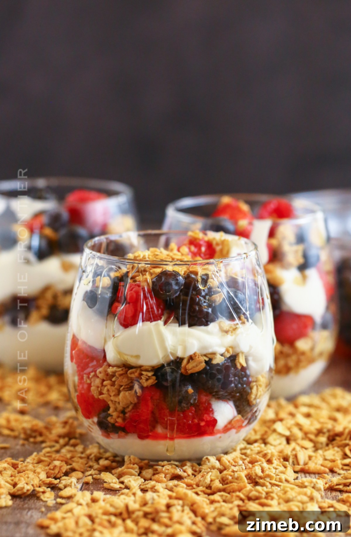 Premium Layered Dessert Glasses 4 Close-up of a layered Parfait Cup with smooth yogurt and vibrant berries.