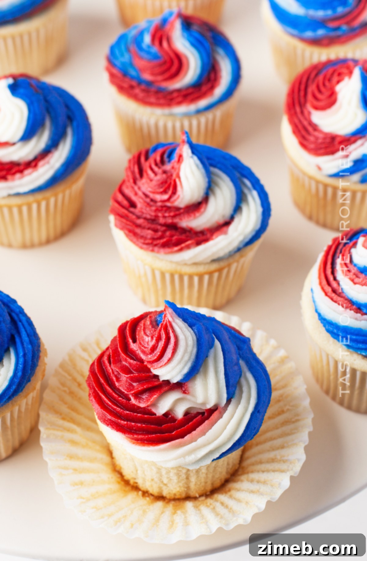 Patriotic Bites 26 Patriotic Cupcakes decorated with red, white, and blue frosting.