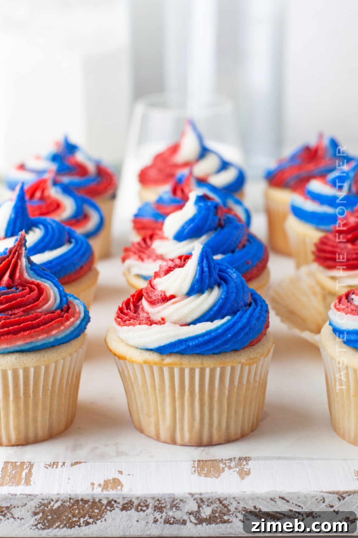 Patriotic Bites 28 Summer party cupcakes with colorful swirls.
