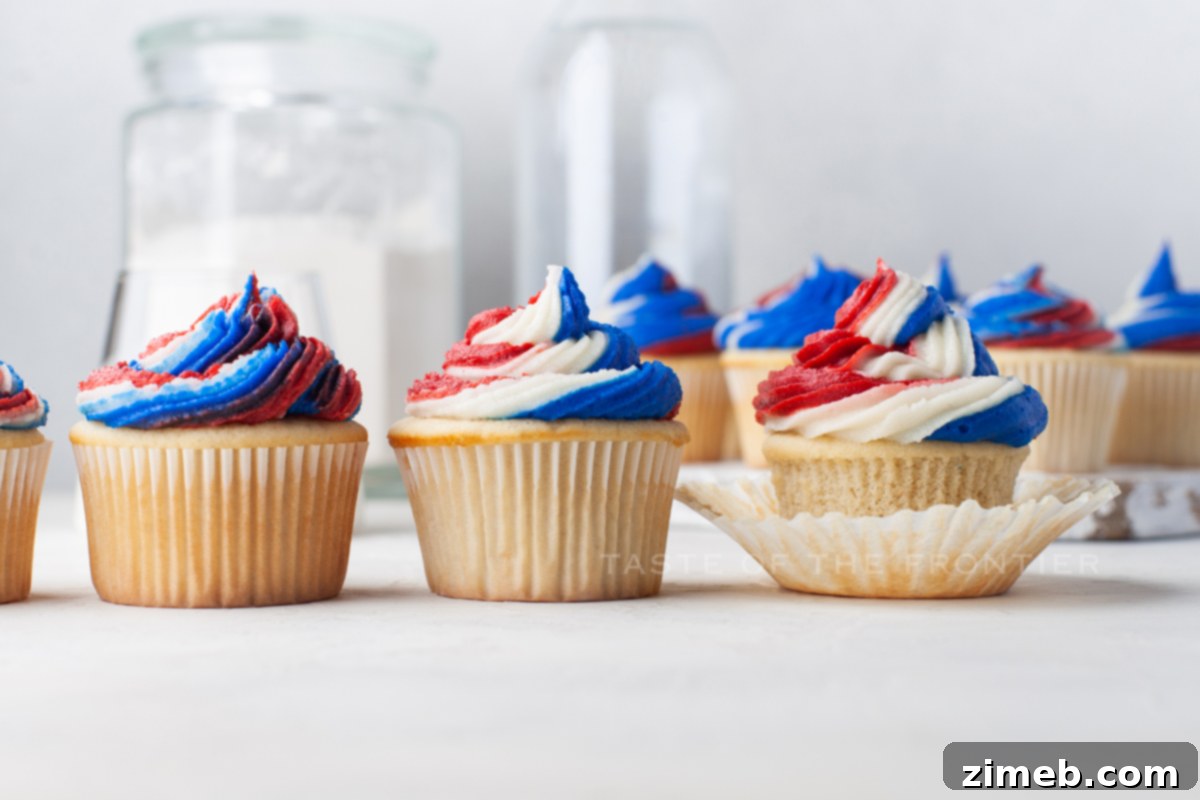 Patriotic Bites 4 Frosting swirl patriotic cupcakes in red, white, and blue.