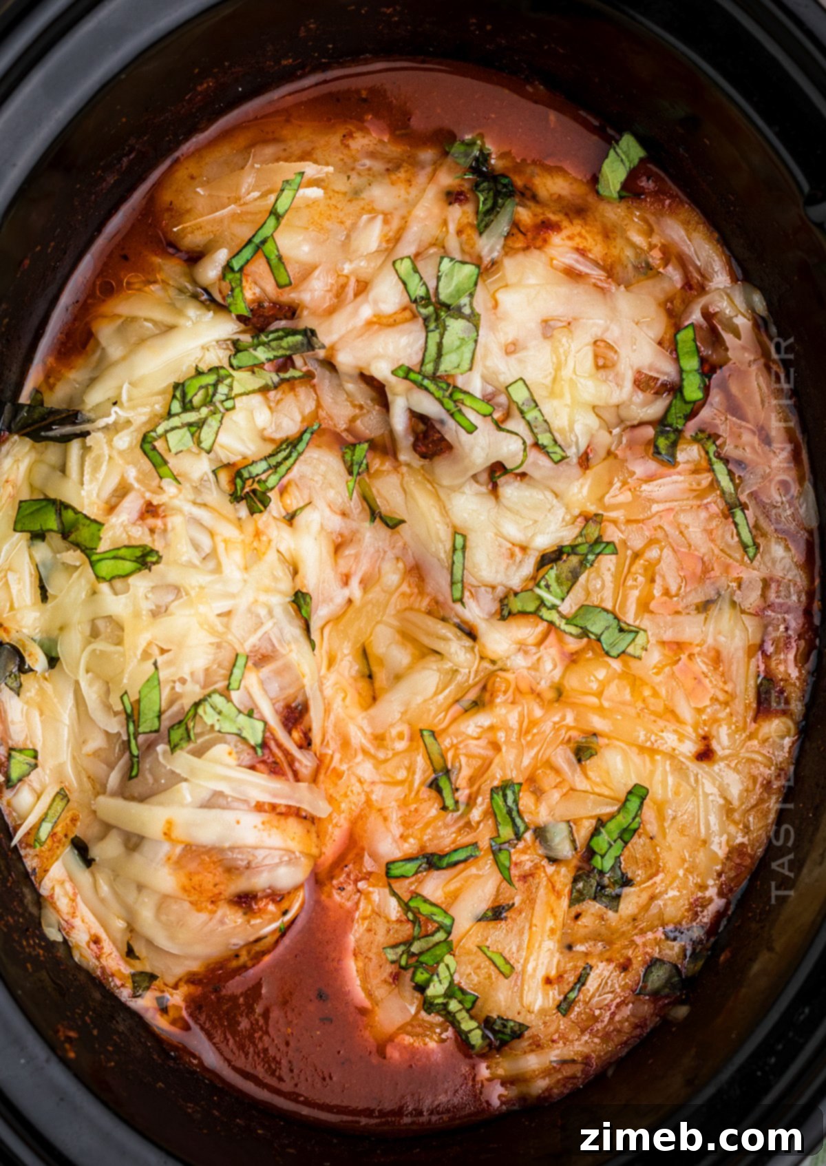 Effortless Slow Cooker Chicken Parmesan 2 Delicious Slow Cooker Chicken Parmesan ready to serve