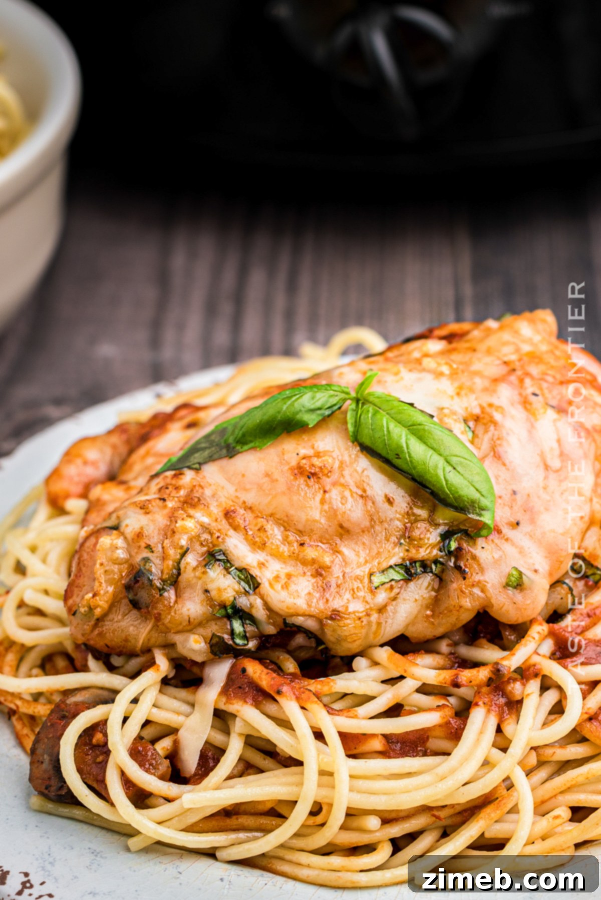 Effortless Slow Cooker Chicken Parmesan 3 Prepped chicken parm ingredients in a slow cooker