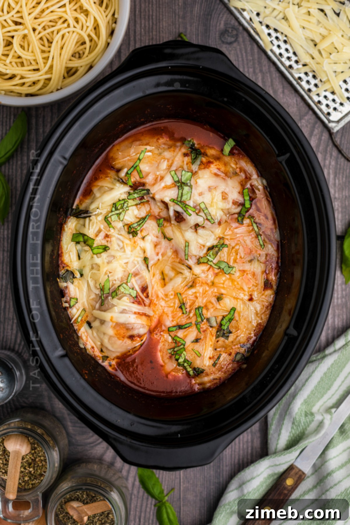 Effortless Slow Cooker Chicken Parmesan 8 Delicious chicken parm dinner served with pasta