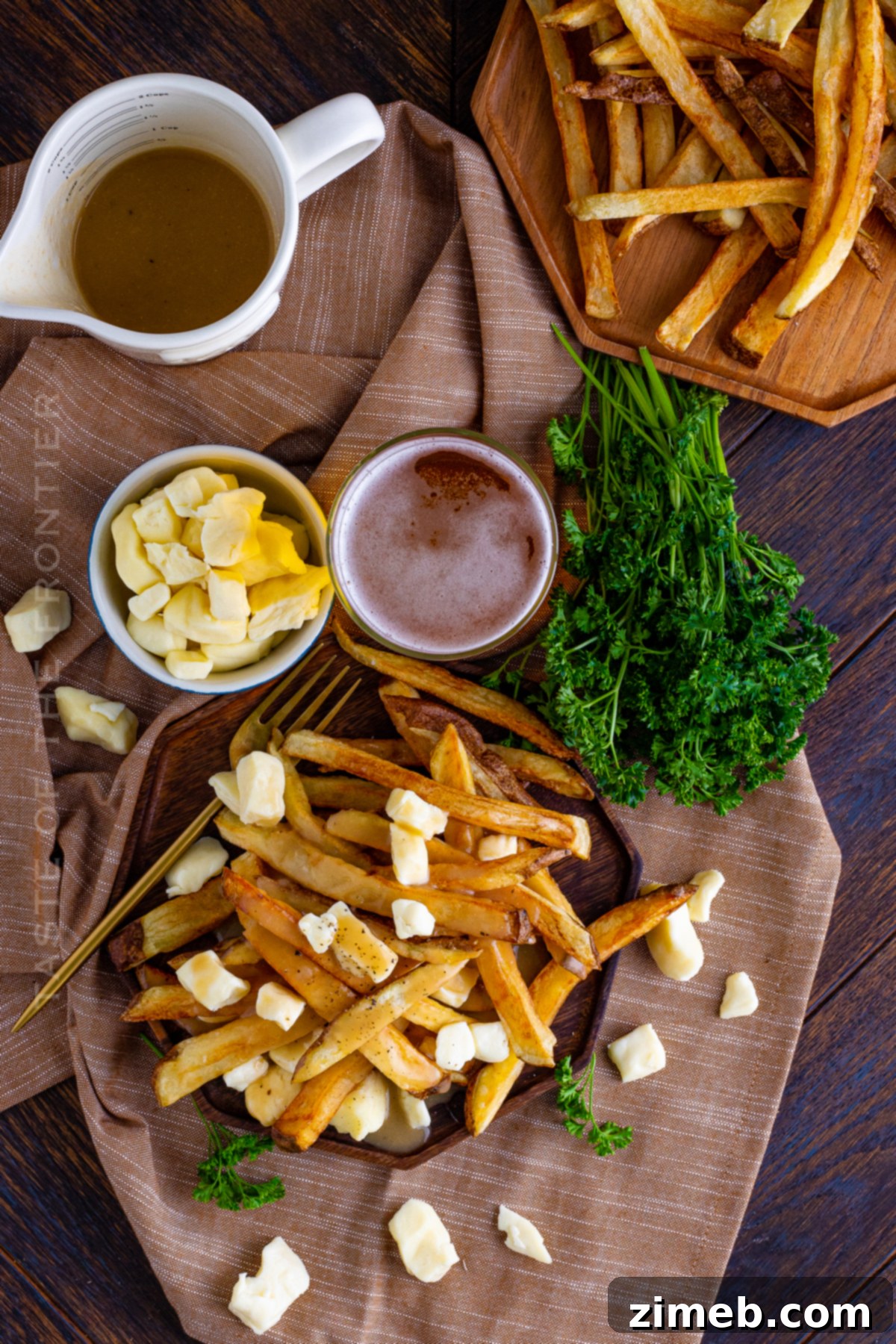 Poutine: Canada's Cheesy, Gravy-Laden Delight 3 Appetizer Poutine served fresh with melting cheese curds and steaming gravy