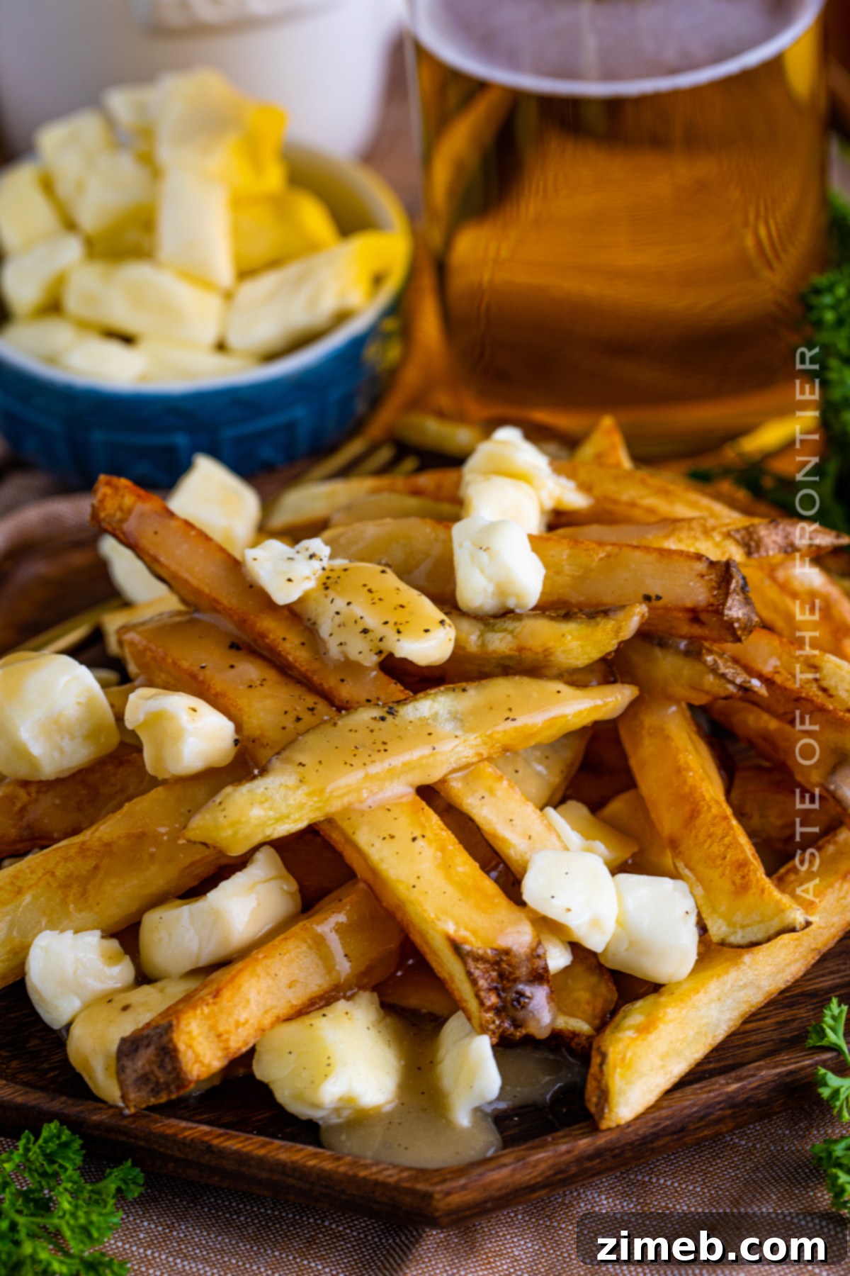 Poutine: Canada's Cheesy, Gravy-Laden Delight 24 French fries with cheese curds, ready for gravy to complete the poutine