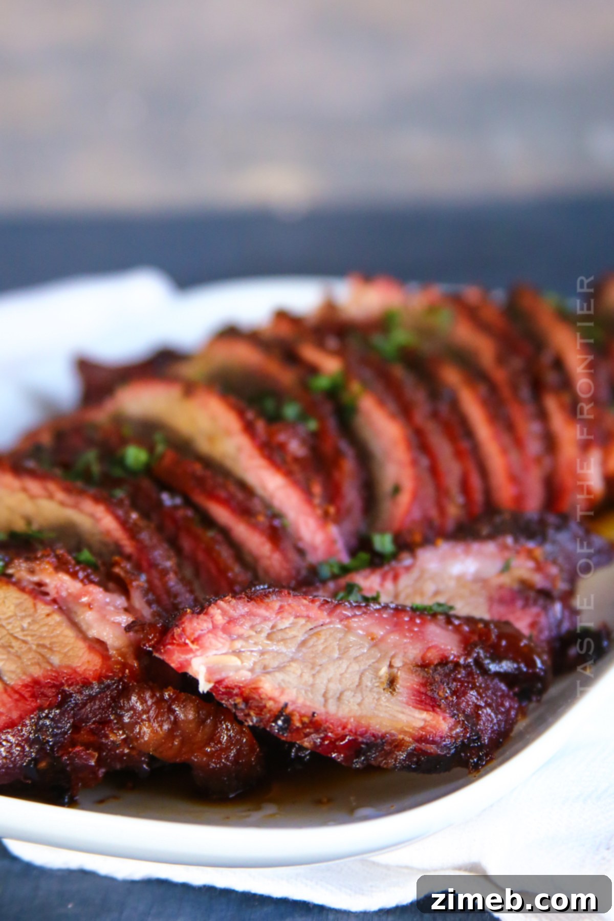 Traeger Beef Roast with a dark bark, ready for slicing.
