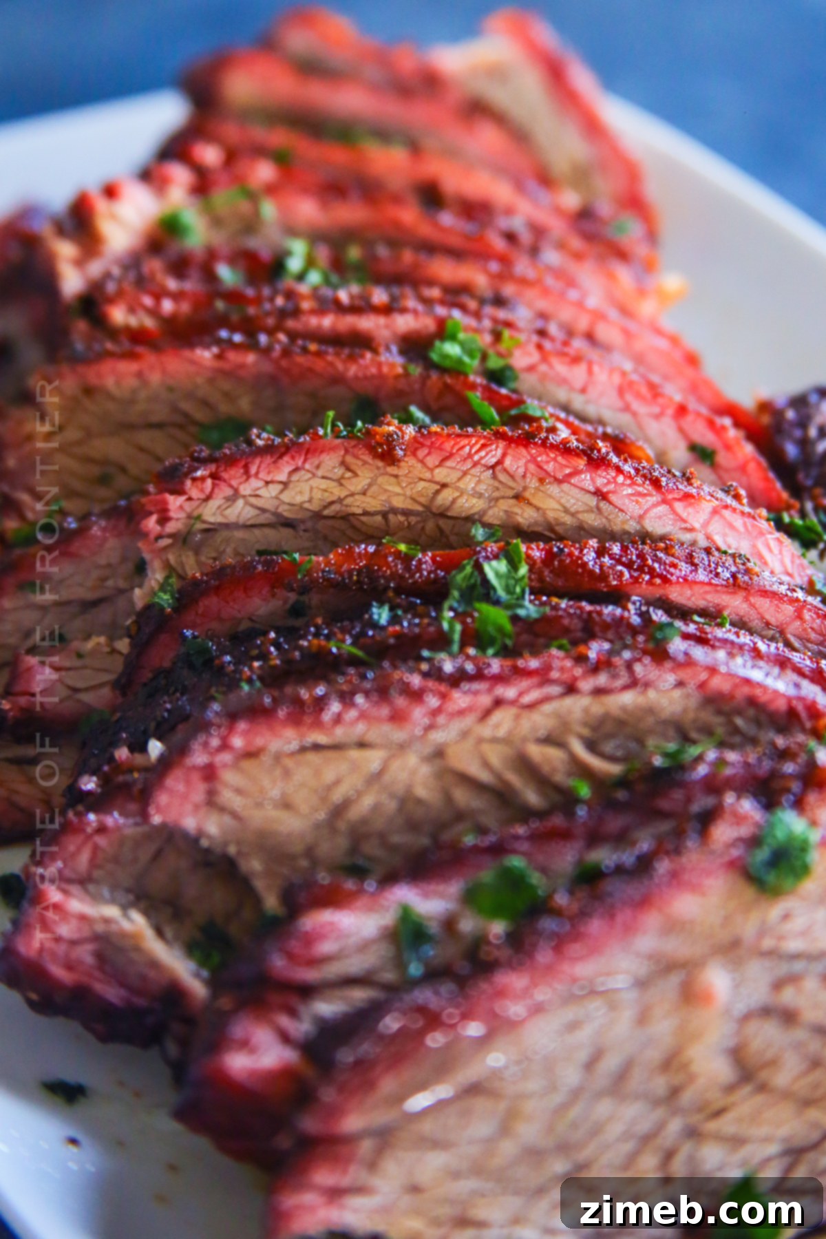 Beautiful Smoke Ring on a Sliced Beef Roast, indicating perfect low and slow cooking.