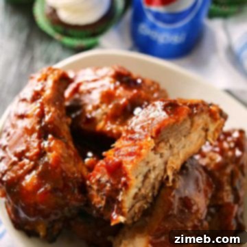 These Crockpot Pepsi® Ribs are so easy to make. Definitely the perfect BBQ recipe to add to your game day spread. Simple slow cooking snacks- YUM! With a simple 5 minute prep- you can't go wrong with these! on kleinworthco.com
