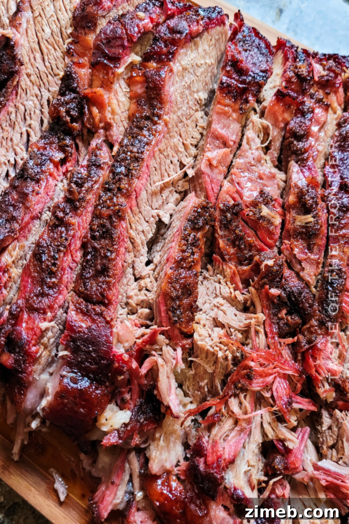 Slow-Smoked Brisket Perfection 3 A perfectly smoked Traeger Brisket, showing the rich bark and juicy interior.