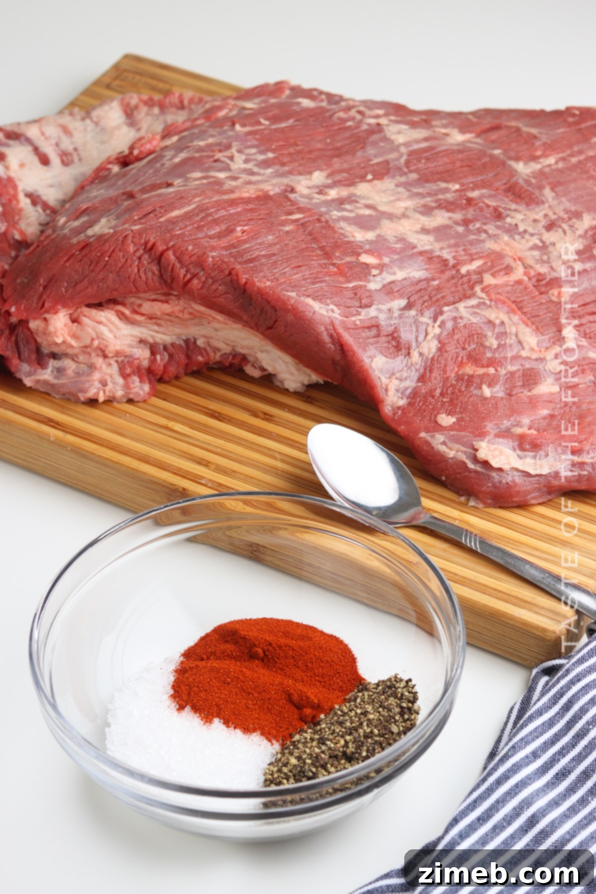 Slow-Smoked Brisket Perfection 5 Ingredients for Smoked Beef Brisket, including a trimmed brisket and seasoning rub.