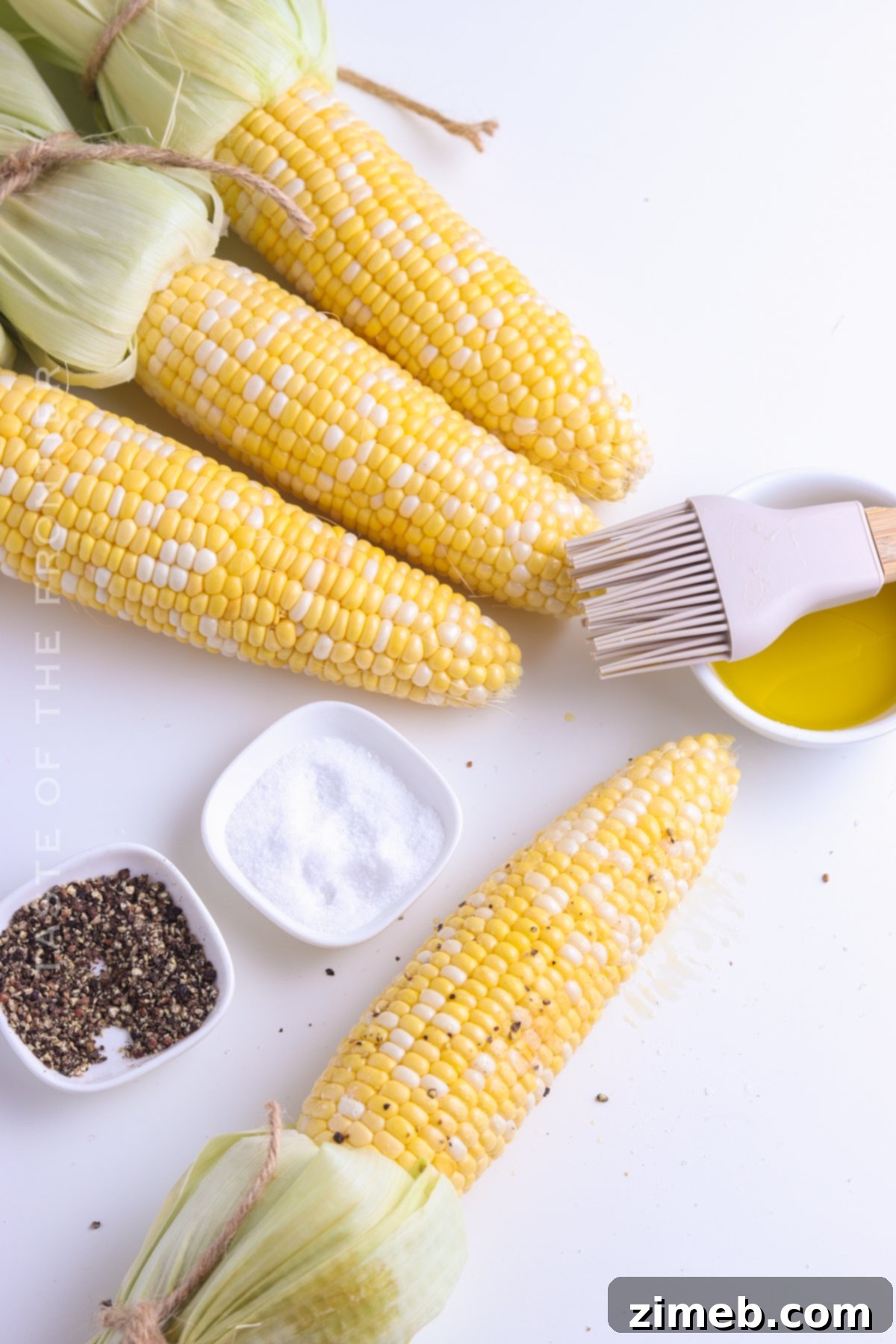 Deliciously Simple Grilled Corn 11 Seasoning corn on the cob with salt and pepper