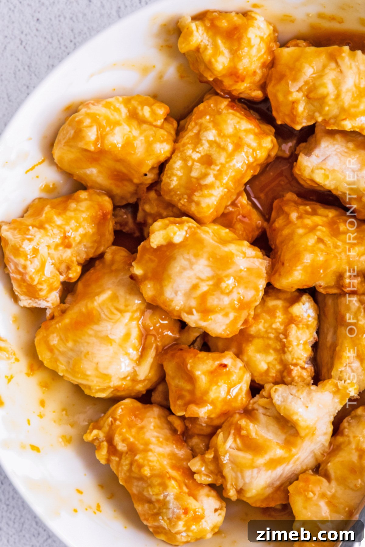 Crispy Air Fryer Orange Chicken 8 sauce on chicken