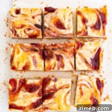 Birthday Bliss Cheesecake 12 Neatly cut squares of strawberry cheesecake bars, showing the creamy filling and crust.