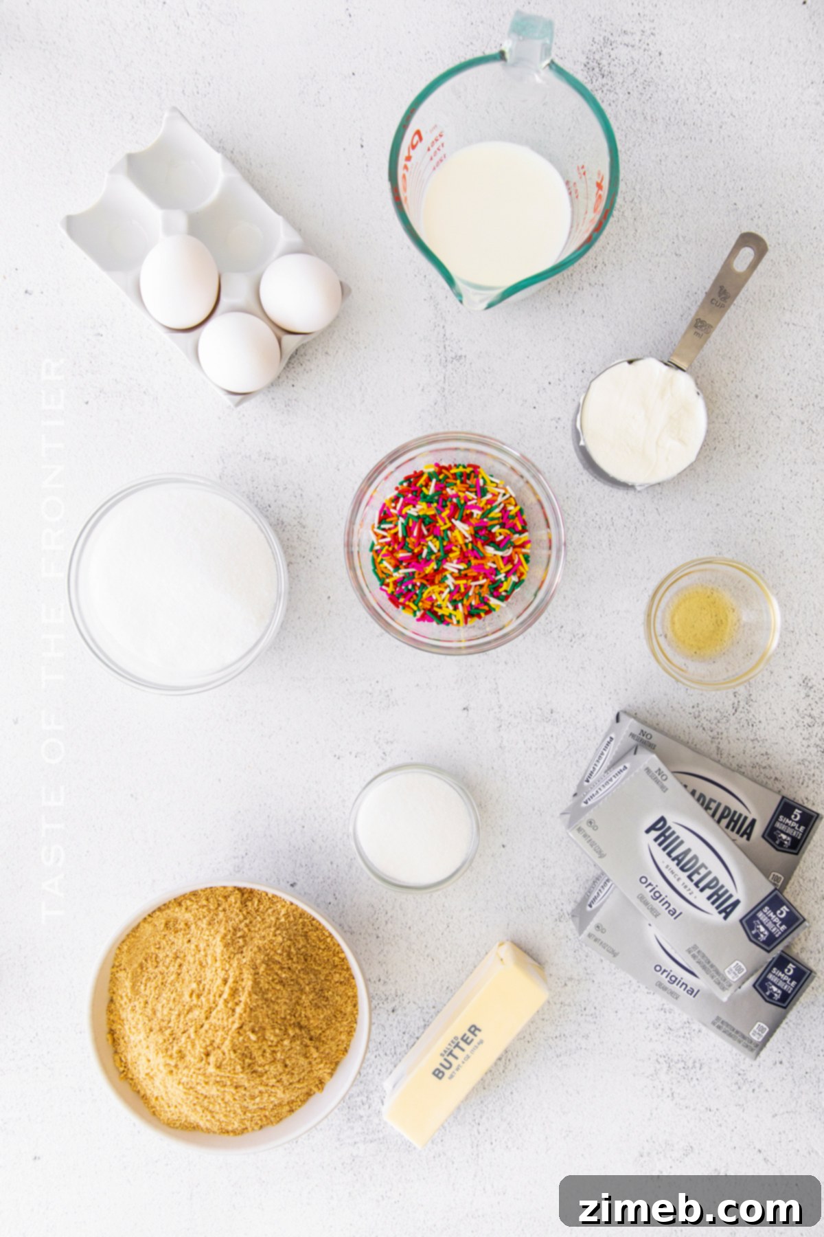 Birthday Bliss Cheesecake 5 A display of all the ingredients needed to make a delicious Birthday Cheesecake.