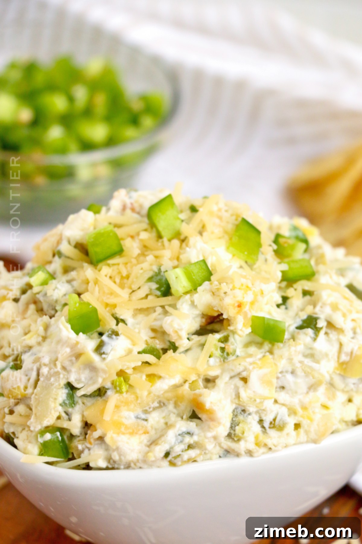 Creamy Jalapeno Artichoke Dip 3 Jalapeno Artichoke Snack appetizer in a white bowl