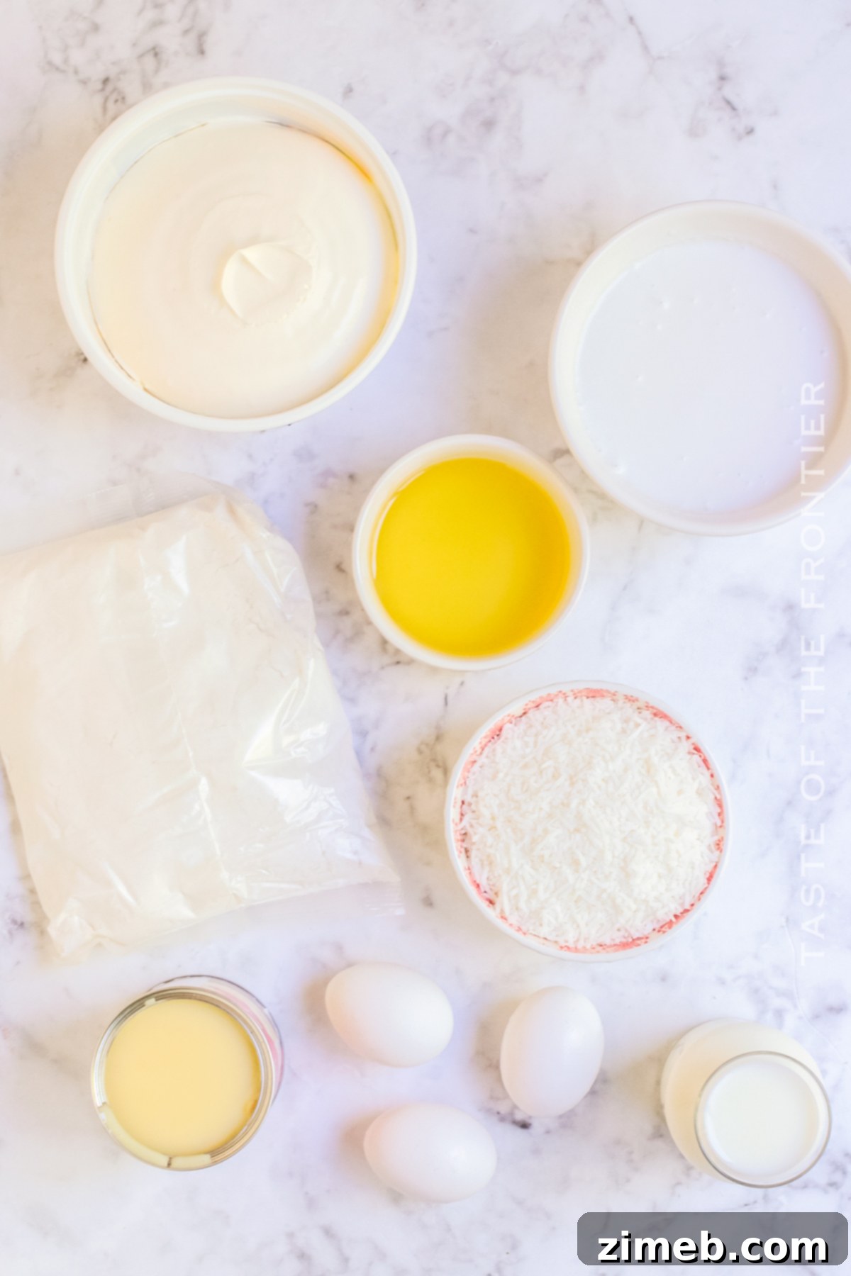 Ingredients for making a homemade Coconut Poke Cake recipe.