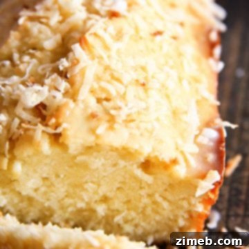 Delicious coconut bread loaf with glaze and toasted coconut.
