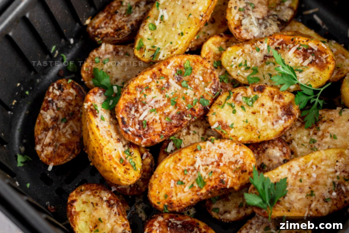 Crispy Air Fryer Parmesan Roasted Potatoes 20 cheesy potatoes air fryer - a close up of the crispy texture