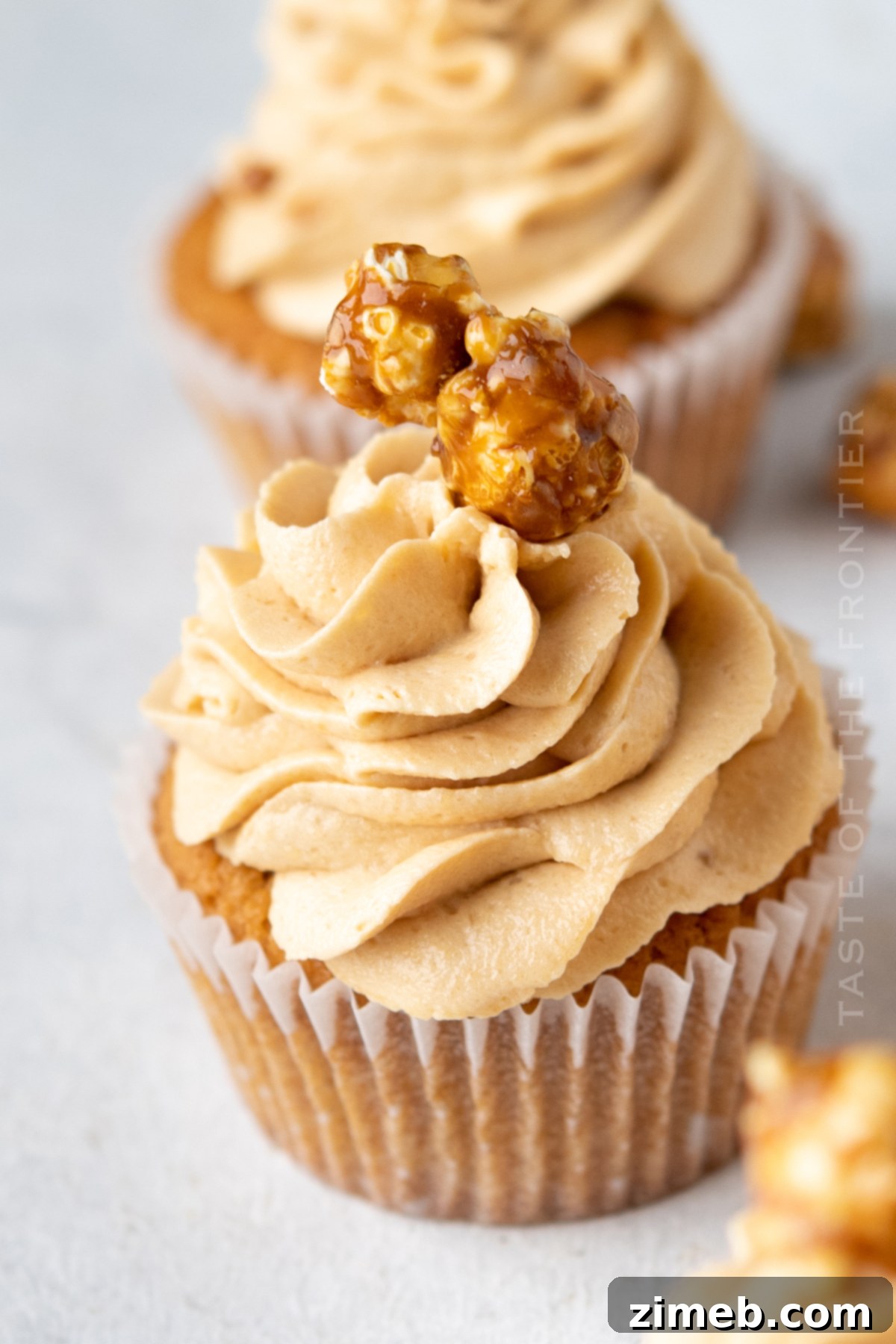 Beautifully piped Caramel Buttercream Frosting on cupcakes