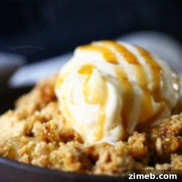 Apple crisp with oatmeal topping and ice cream.