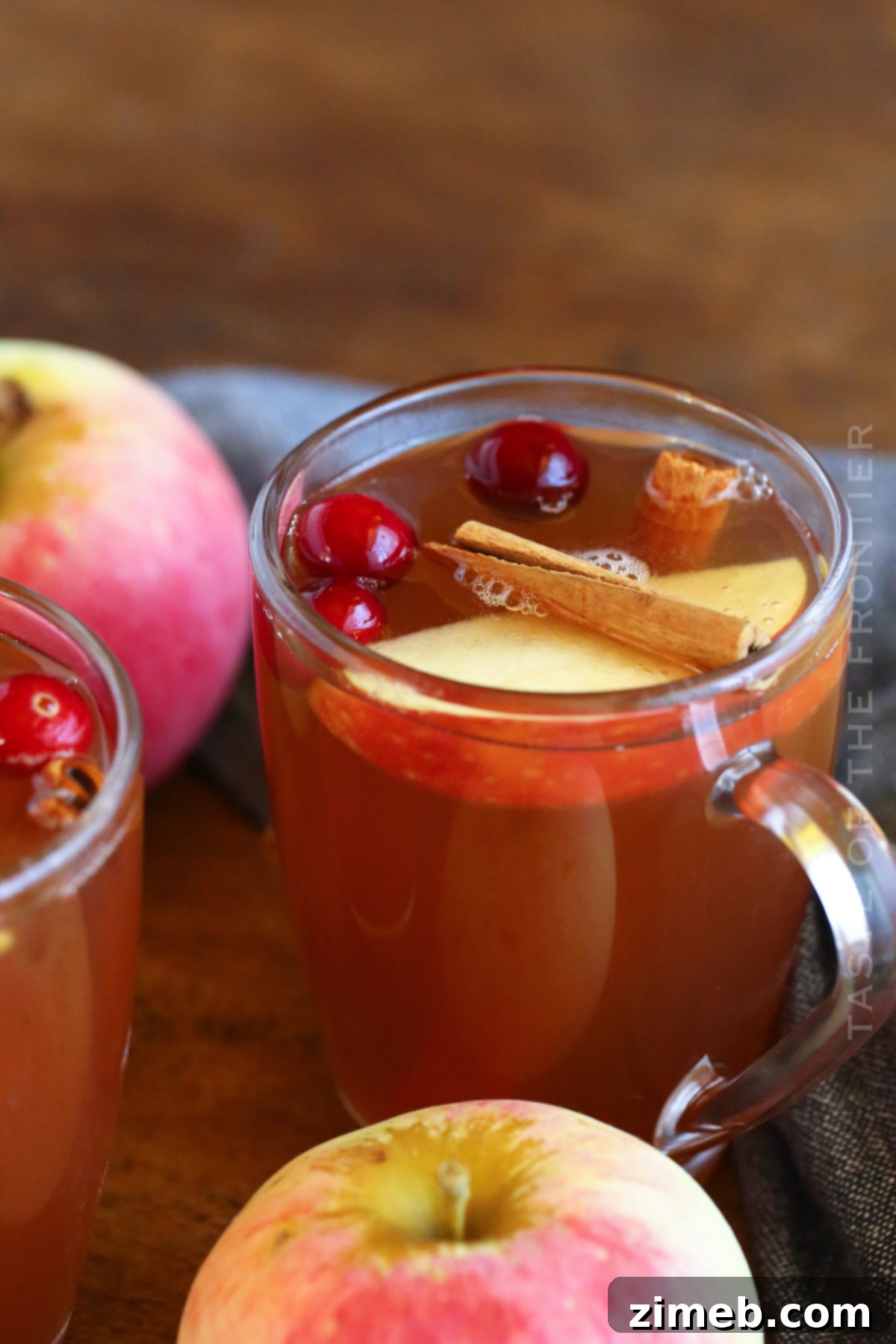 Recipe for Instant Pot Apple Cider with sliced apples and spices, showcasing the ingredients.