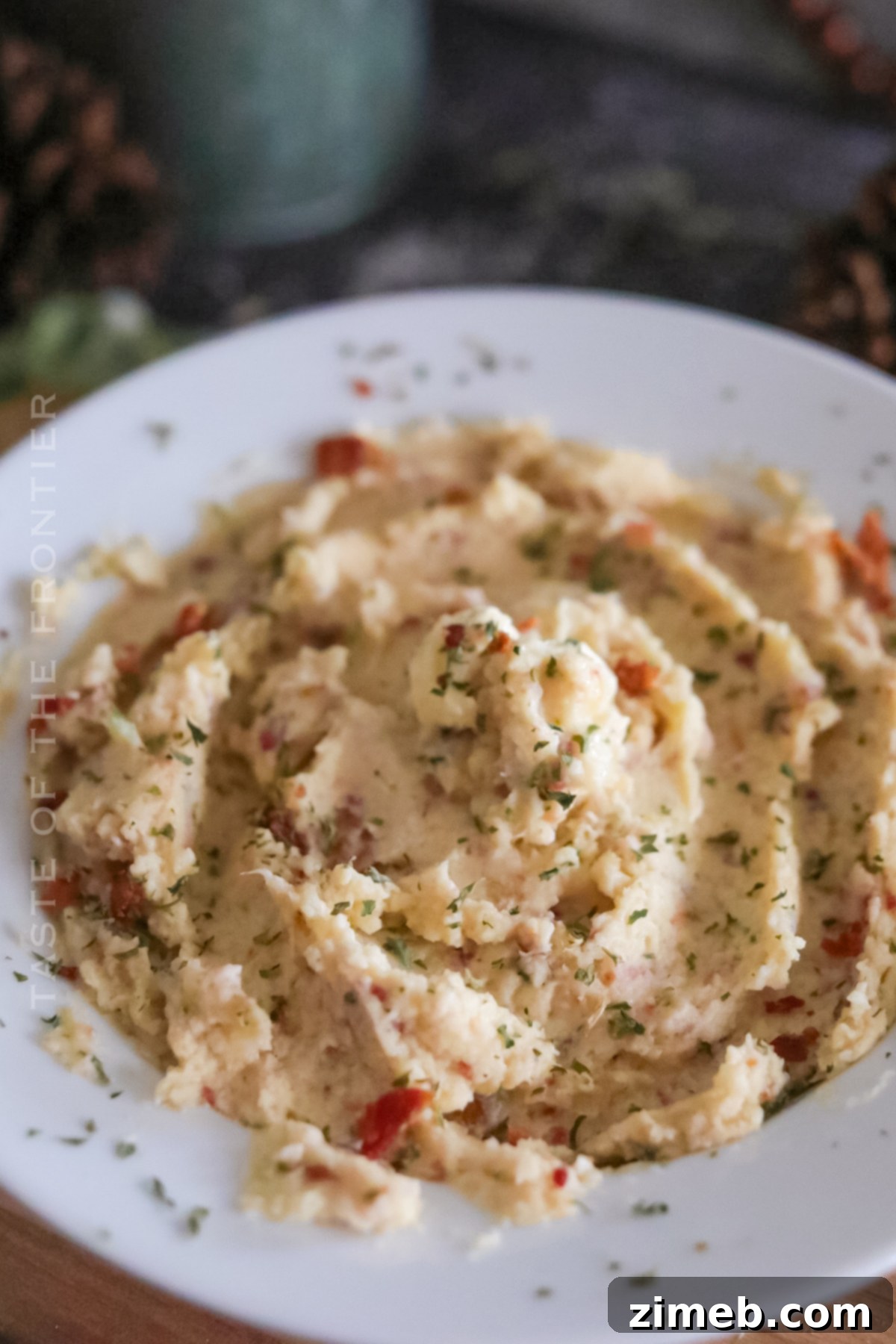 Close-up of fluffy cauliflower mashed potatoes in a bowl.