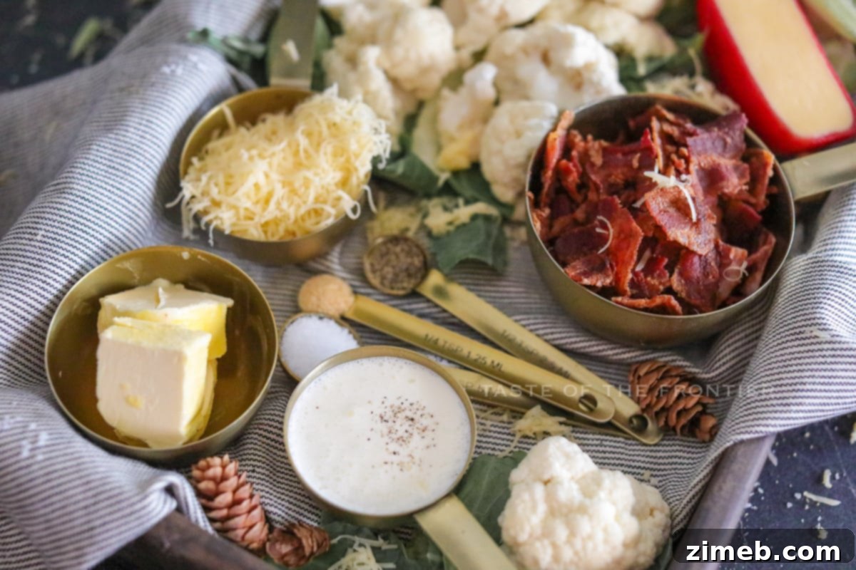 Fresh ingredients including cauliflower, cream, and cheese for cauliflower mash.