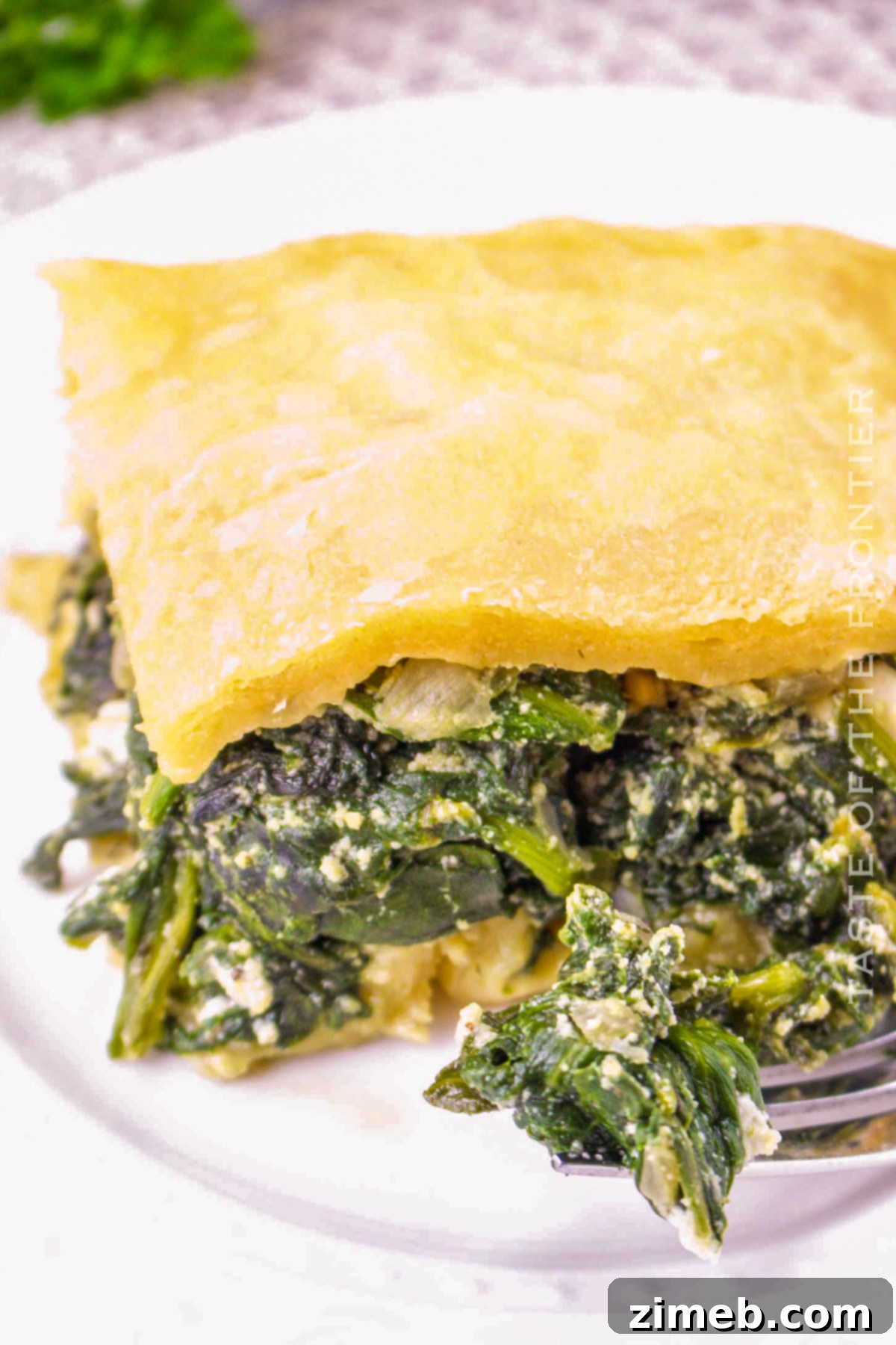 Spanakopita Puff Pastry - Flaky layers for a delicious spinach pie.