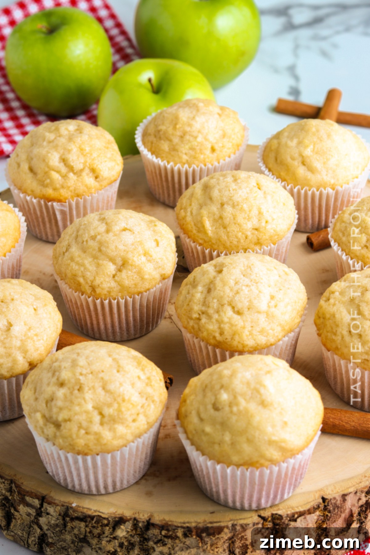 Cozy Apple Cinnamon Muffins 3 Freshly baked Apple Cinnamon Muffins with a sprinkle of cinnamon