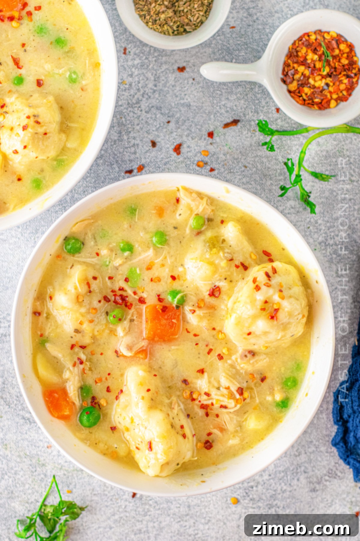 Your Go-To Instant Pot Chicken and Dumplings 19 Homemade dumplings with chicken, simmering in a rich broth.