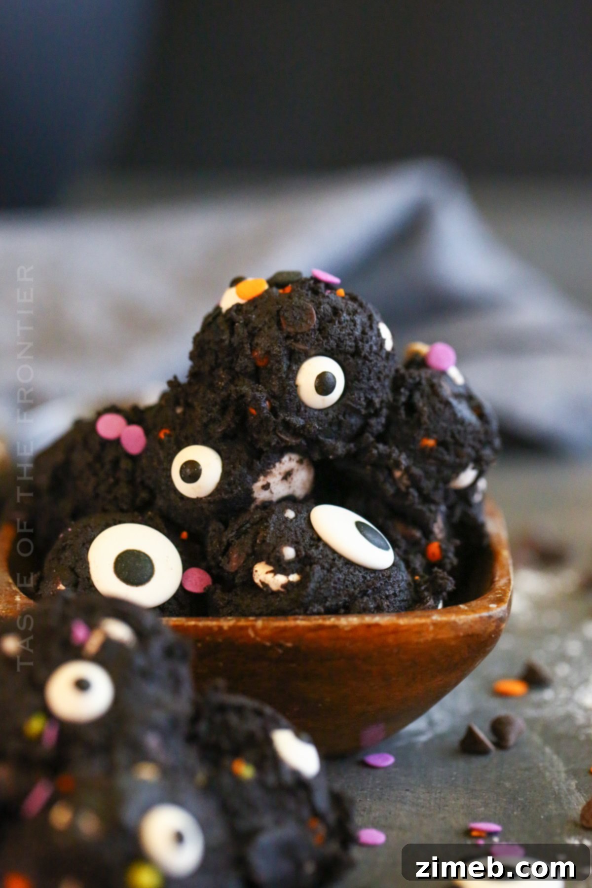 Edible Halloween Cookie Dough 19 No-bake cookie dough in a jar, topped with sprinkles and candy eyes.