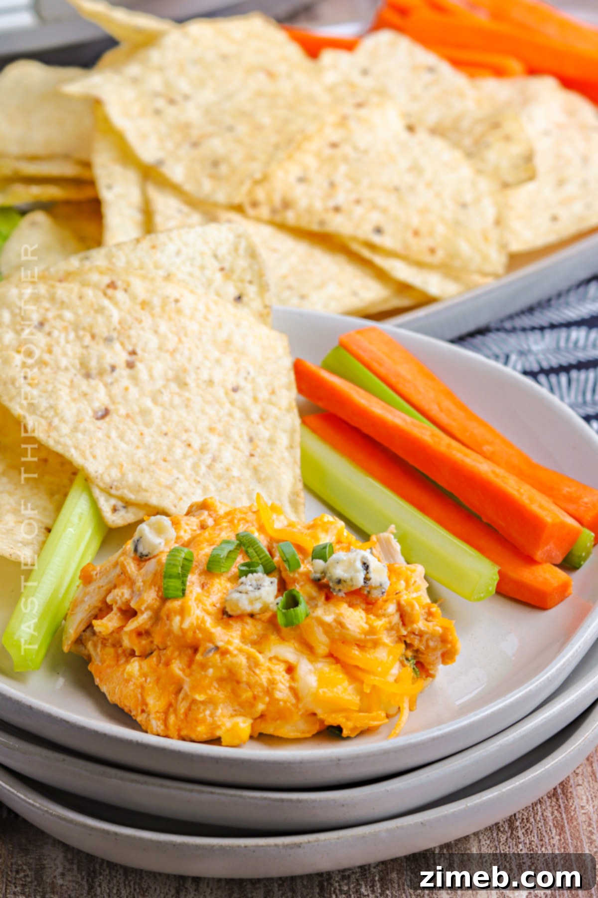 Crock-Pot Buffalo Chicken Party Dip 18 Recipe for Slow Cooker Buffalo Chicken Dip, showing the finished product in a crockpot with dippers.