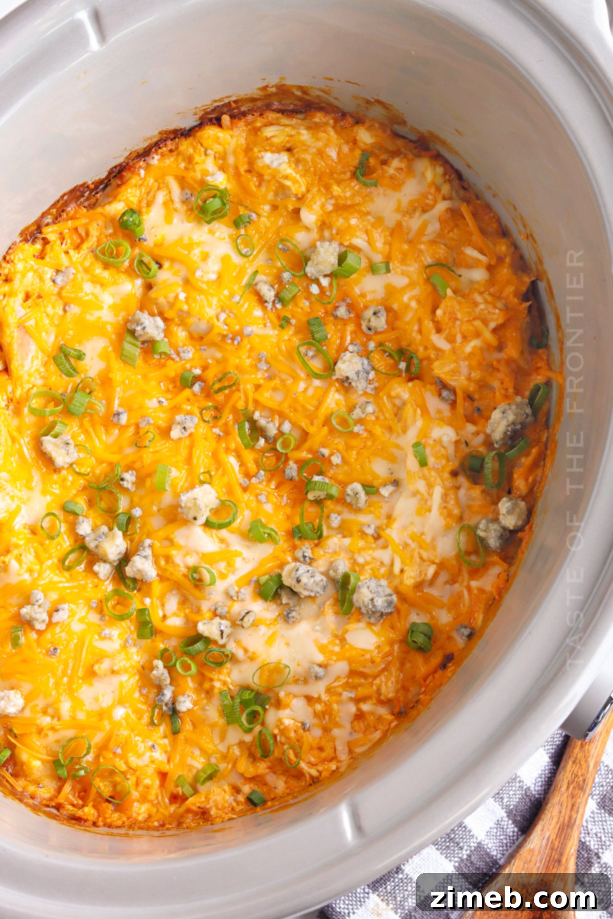 Crock-Pot Buffalo Chicken Party Dip 19 Finished Buffalo Dip in a Crock Pot, ready to serve with celery and crackers.