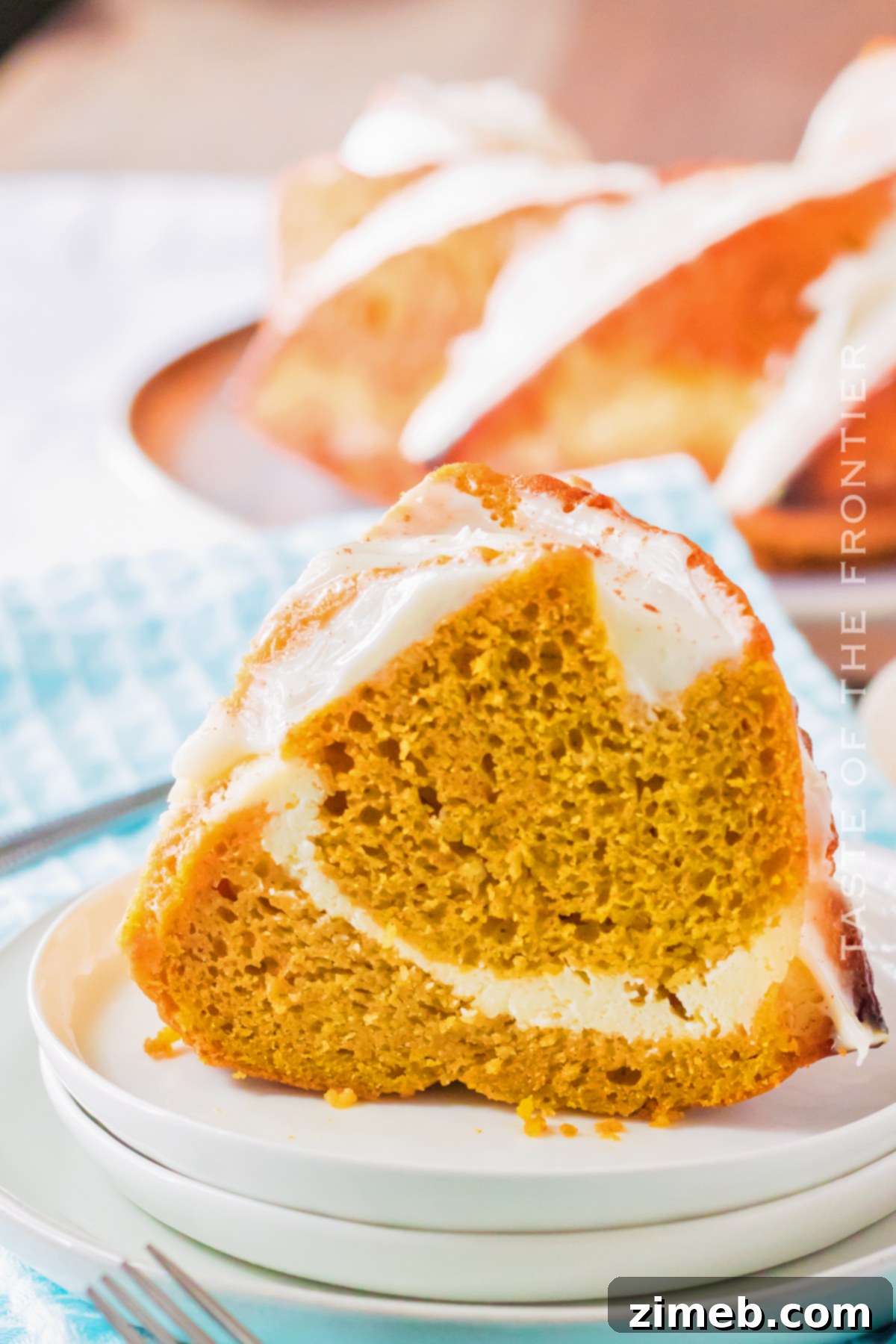 Golden Pumpkin Bundt with Cheesecake Surprise 22 slice of pumpkin cake with cheesecake filling