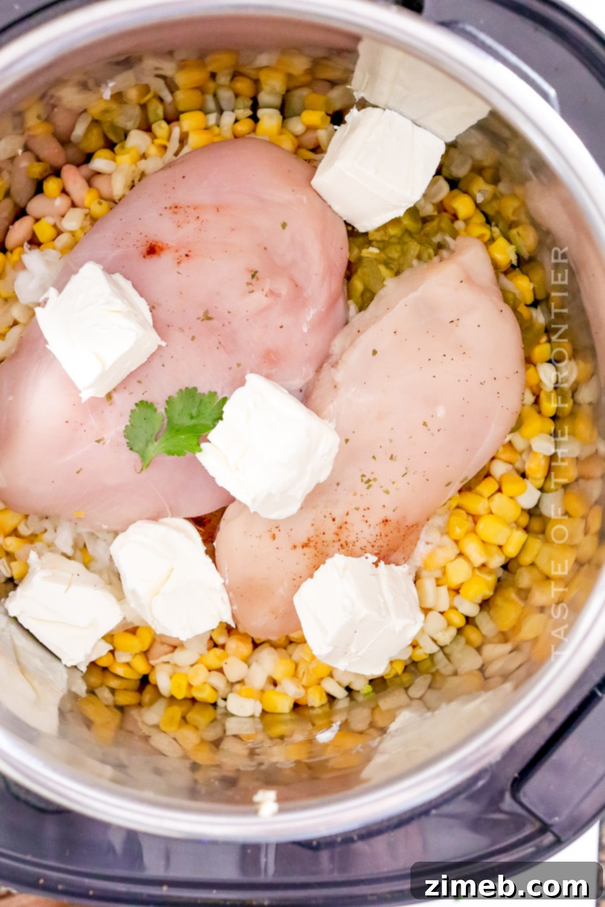 Instant Pot Creamy White Chicken Chili 6 adding chicken and cream cheese chili