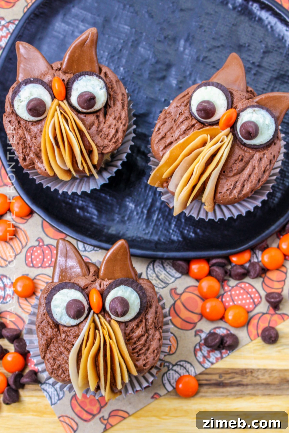 Thanksgiving cupcakes decorated with fall themes, featuring delightful owl designs.