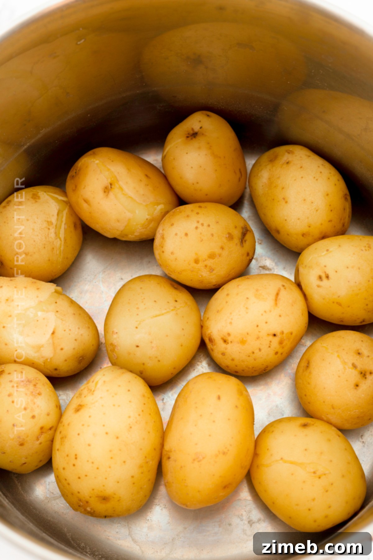 Crispy Smashed Potatoes 5 Baby potatoes boiling vigorously in a pot of salted water on the stovetop, indicating the first step in making smashed potatoes.