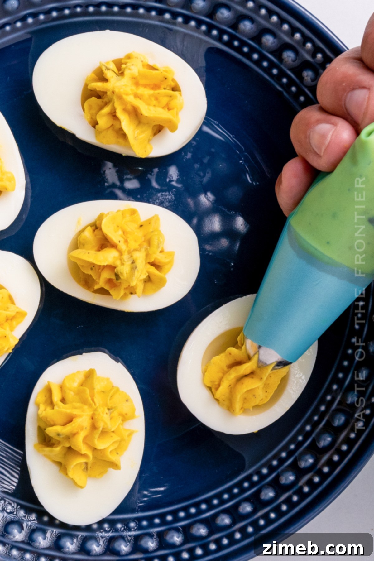 Loaded Bacon Deviled Eggs 11 filling the centers