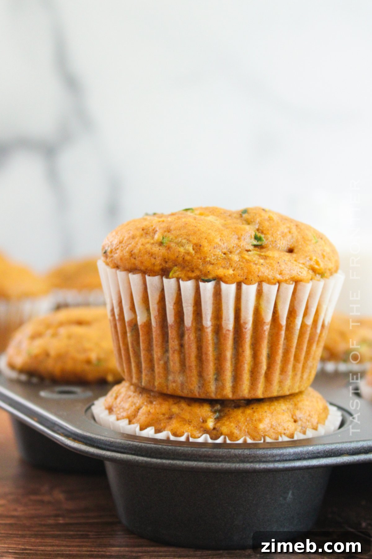 Spiced Autumn Zucchini Pumpkin Delights 22 The best Pumpkin Zucchini Muffins cooling on a rack