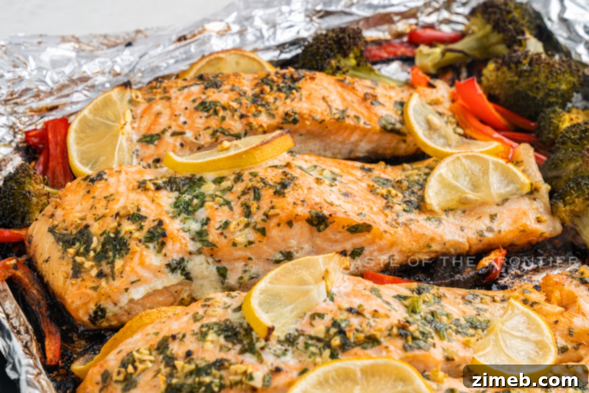 Oven Baked Salmon, perfectly cooked with lemon and herbs, presented as a healthy, delicious meal.