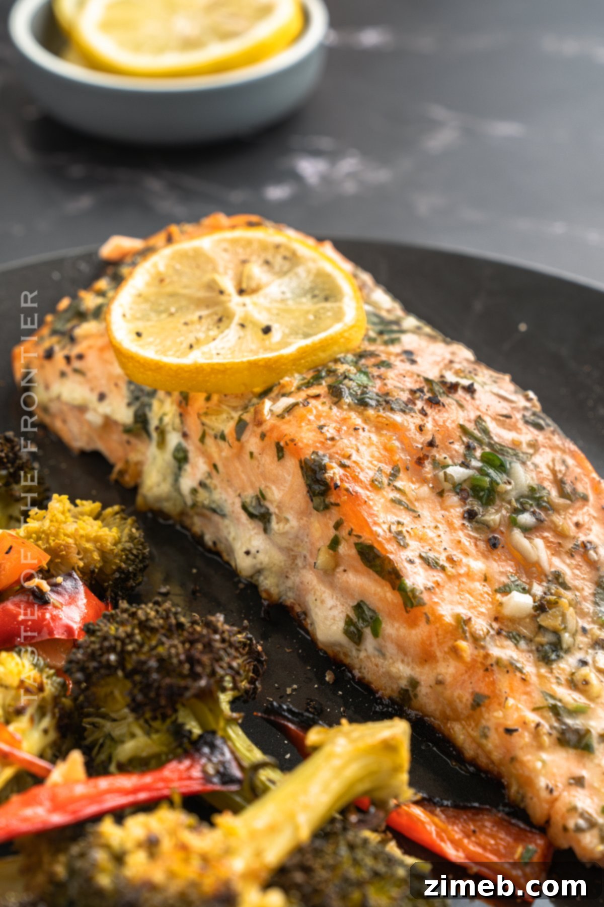 Baked Salmon Recipe, featuring lemon, garlic, salt, pepper, and parsley, perfect for a healthy weeknight meal cooked in the oven.