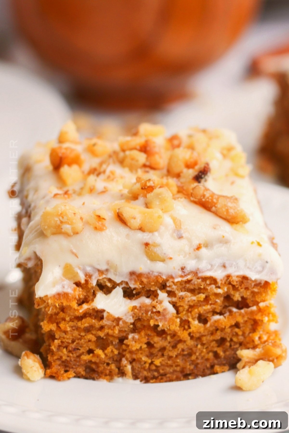 Delightfully moist Pumpkin Spice Cake with creamy frosting, perfect for fall and holidays.