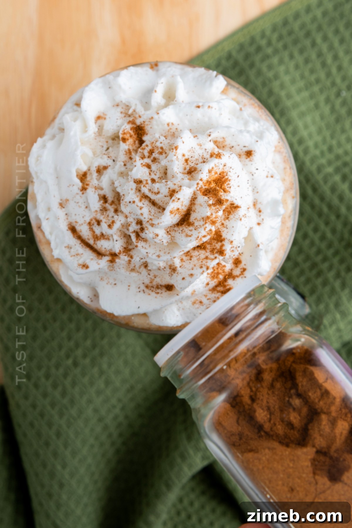 Pumpkin Spice Latte 21 Adding whipped cream and cinnamon to a delicious pumpkin spice latte.