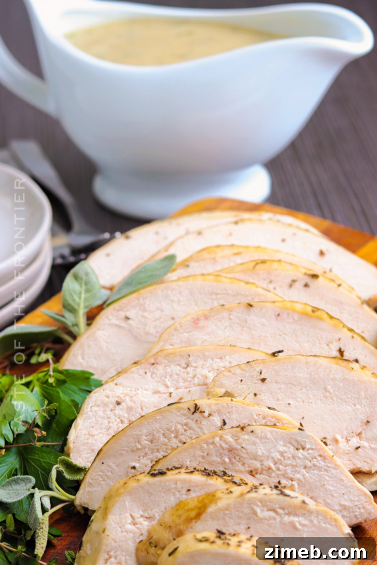 Perfectly sliced turkey breast covered in rich, homemade gravy, ready for serving.