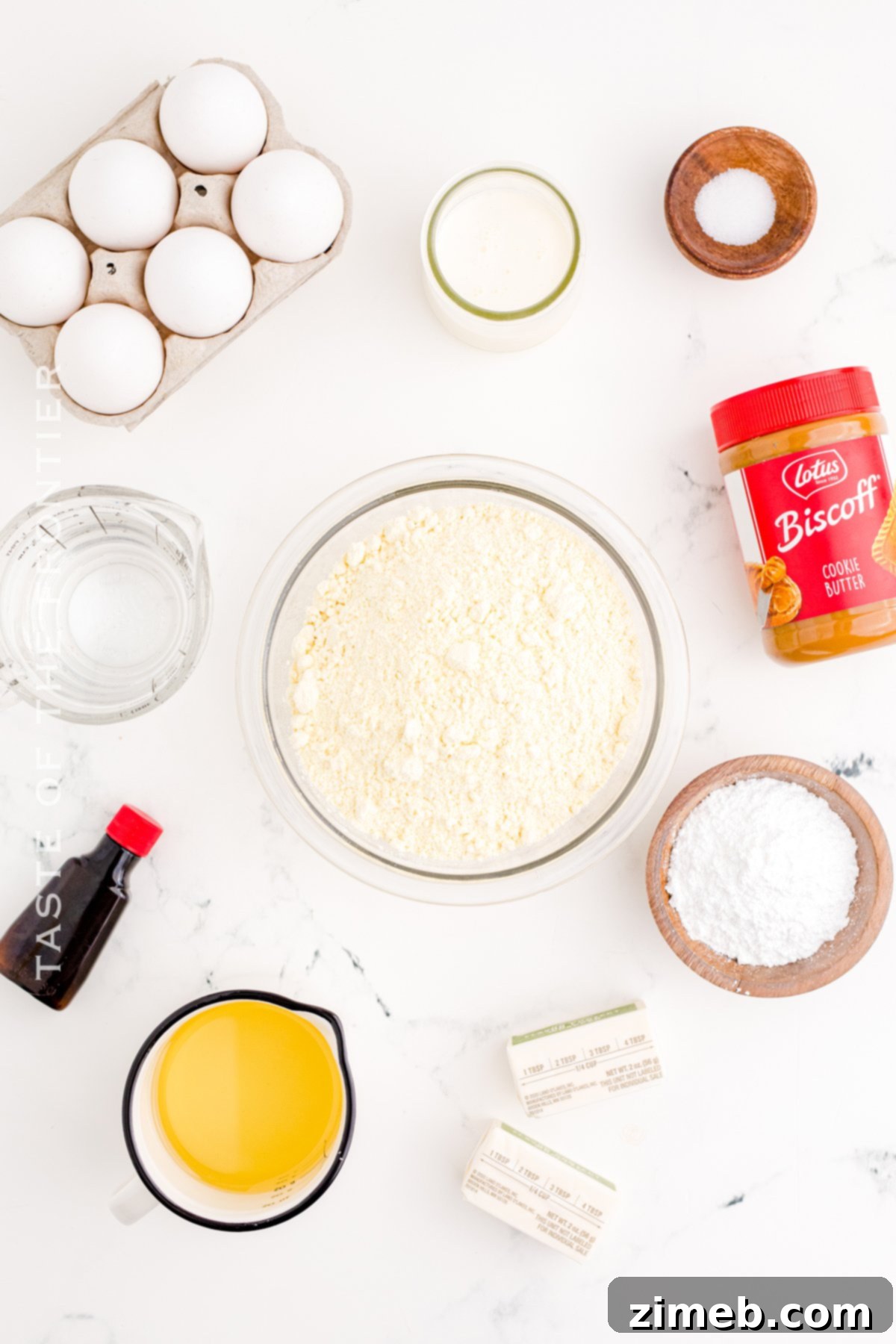 Lotus Biscoff Dream Cupcakes 4 Selection of ingredients for baking Biscoff Cupcakes, including cake mix, eggs, oil, and cookie butter