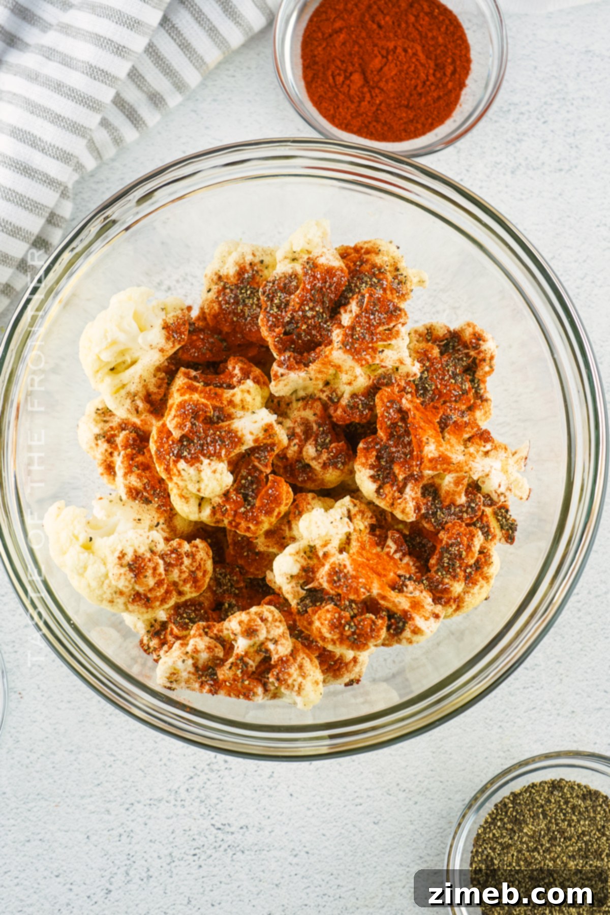 Tossing Cauliflower with Seasonings for Air Frying